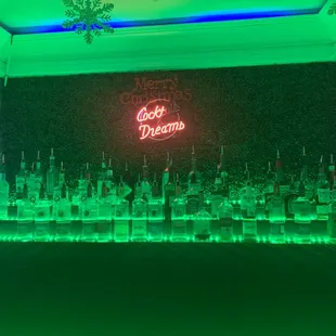 a neon sign in a bar
