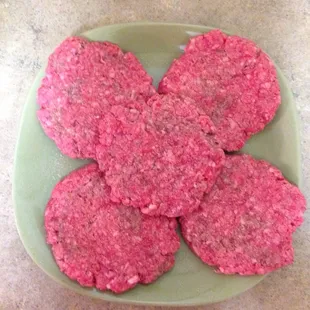 Fresh ground beef patties for burgers.