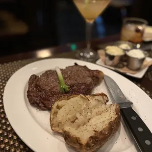 Ribeye, baked potatoes, and apple cider martini