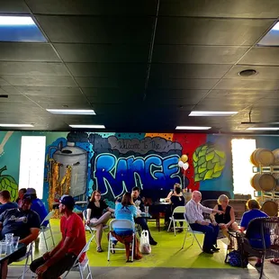 a large group of people sitting at tables