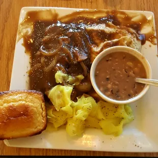 Smothered steak, cabbage, black eyed peas, mashed potatoes, and cornbread.  Excellent meal.