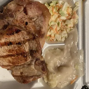 Pork chops, mashed potatoes w/gravy, and coleslaw