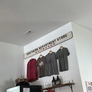 t - shirts hanging on a wall