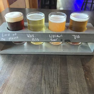 Beer flight: Lords of the Plains, Wax pils, Waiawi Sour, and District 10