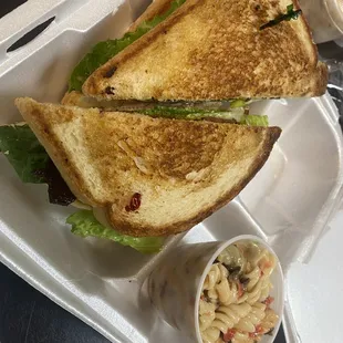 a sandwich and macaroni salad