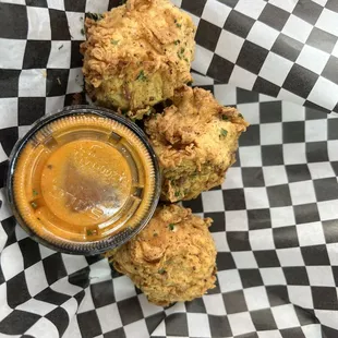 fried chicken nuggies with a side of sauce