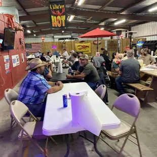 a large group of people sitting around a table