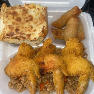 Korean Freid Chicken over Korean Fried Rice alongside house made Egg Rolls &amp; Cream Cheese Garlic Bread