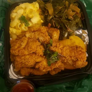 Catfish nuggets, Mac n cheese, and greens +1 cornbread muffin.