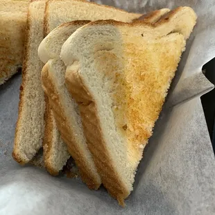 a toasted sandwich in a basket