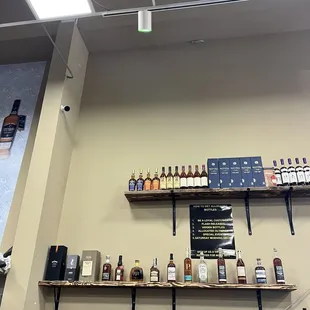 shelves with bottles of liquor and a menu