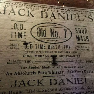 jack daniels advertisement on brick wall