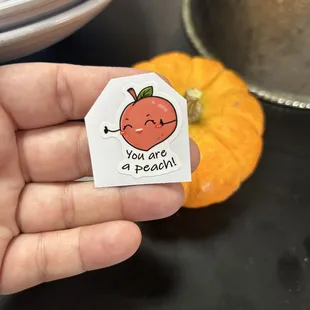 "Please only take one" Sticker or small treat at the counter