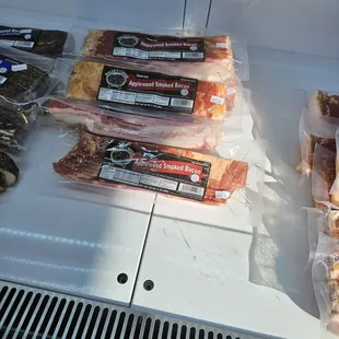 a display of bacon and sausages