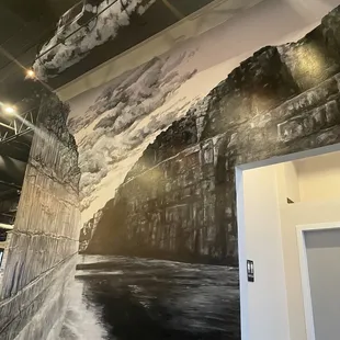 a black and white photo of a river