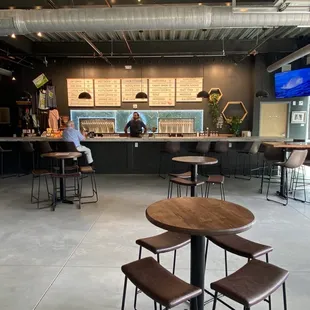 a man sitting at a table in a coffee shop