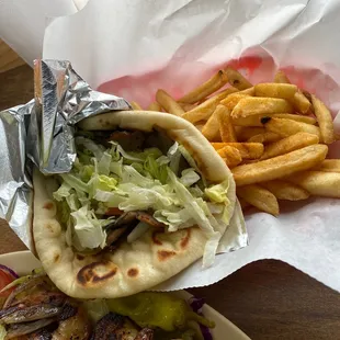 a pita sandwich and french fries