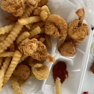 Fried shrimp hush puppies and fries