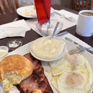 Two eggs grits hams and biscuit