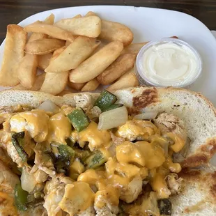 Chicken Philly sandwich with fries.