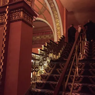 Going upstairs to an even narrower staircase to be seated.