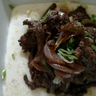 beef and onions on a tortilla