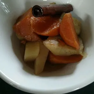 a white bowl filled with sliced vegetables