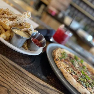 Pear &amp; Bleu pizza with truffle fries.