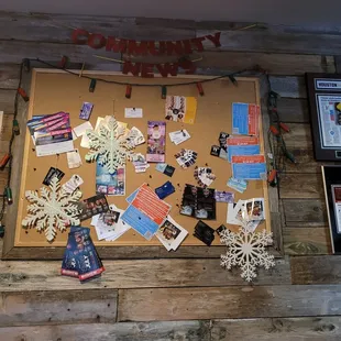 bulletin board with many items on it