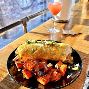 Veggie omelet with ham and sweet potato country potatoes.