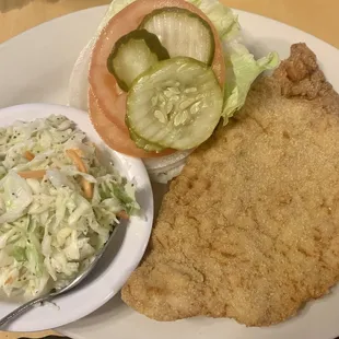 Half of a tenderloin with some sweet slaw.