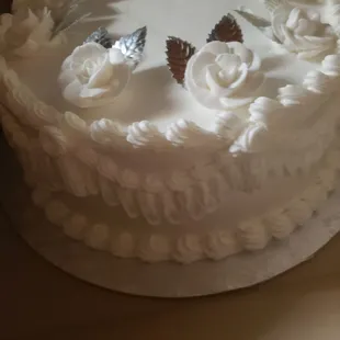 a white frosted cake on a table