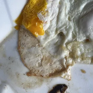 Supposed to be fried egg cooked over-medium. This is Disgusting. Very over cooked. What is that nasty black stuff?