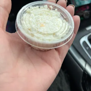 Tiny side of feta that was charged $3 for.. and what is that orange stuff? Thought feta is white!?