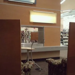 Glass encased fireplace with easy chairs