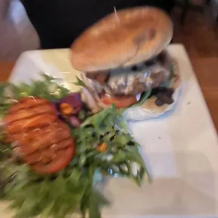 a plate with a sandwich and salad on it