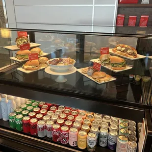 a display case with a variety of food items