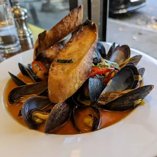 Steamed P.E.I. Mussels. $18. Chorizo, Fresno chile, leeks, fennel, basil, shellfish broth, toasties.