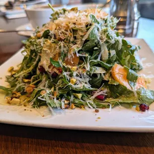 Wild Arugula Salad. $13. Persimmon, pomegranate seeds, pistachios, fennel, Grana Padano, lemon-pistachio vinaigrette.