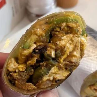 Southie breakfast burrito with scrambled eggs, house made chorizo, cheddar, avocado, onion-pasilla pepper relish, chipotle aioli! Amazing!!