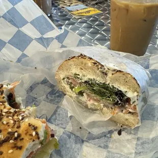 The Lux with scallion cream cheese. I added greens and spicy pickles as well! Also on the right is their honey latte iced with oat milk!