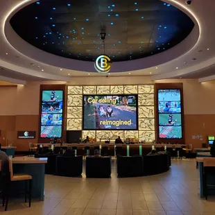 a casino lobby with a large screen
