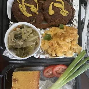 Salmon croquettes, Mac n cheese, cabbage, cornbread!! Fire!! The best I've had