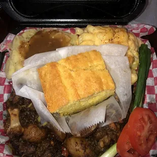 Oxtail Dinner w/ Cornbread, Rice &amp; Potatoes. I chose Mac N Cheese &amp; Mashed Potatoes w/ Gravy for my 2 sides.