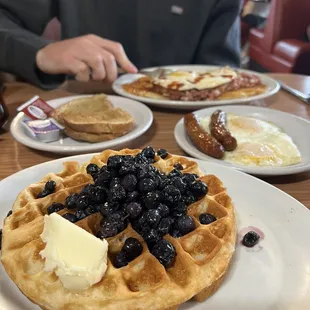 a waffle with blueberries and butter