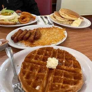 Waffle with hash browns, sausage, 3 pancakes, and a bacon avocado cheeseburger. :)