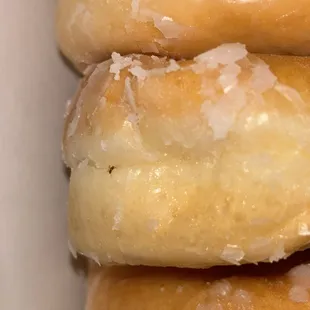 An ant or a spider is cooked on my donut. I called the store and they did not answer the phone to resolve my issue. This is unacceptable!