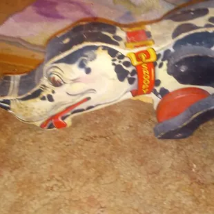 NEEDING to sale my wooden dog toy antique collectible had when I was Litt girl I&apos;m 63now