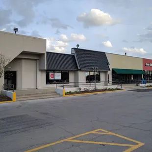 To the left of Panera and Great Clips