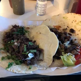 Barbacoa taco and carne asada taco